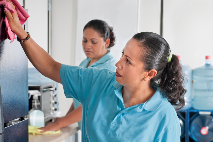 Hispanic Women Cleaning Service Clean a Corporate Lunch Room